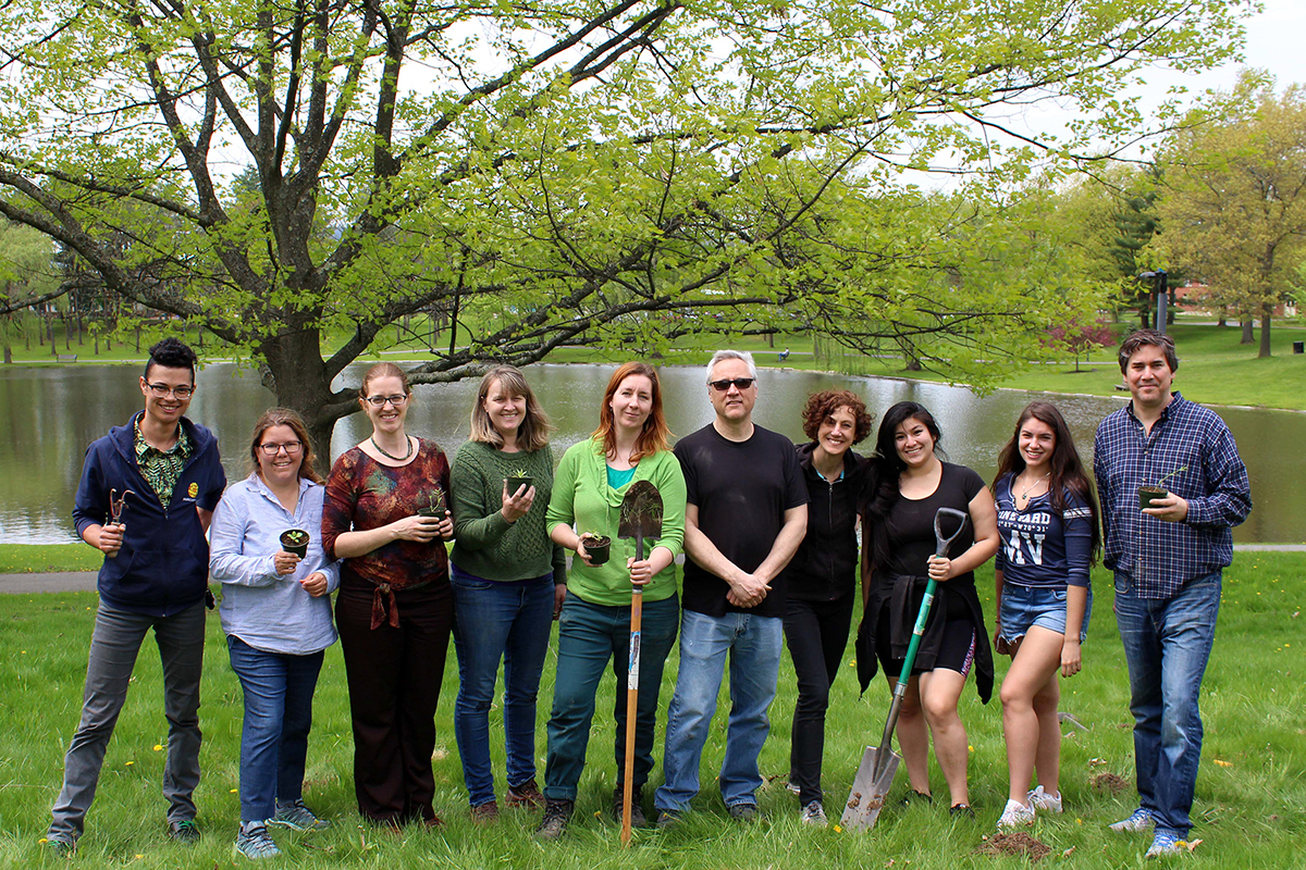 campus members at grand opening of pollinator friendly meadow